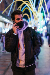 Sticker - Shot of a man in a medical mask  talking on the phone