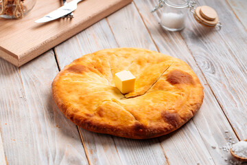 Georgian cuisine megrelian khachapuri bread on the wooden table