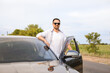 © Pixel-Shot - Handsome man near modern car