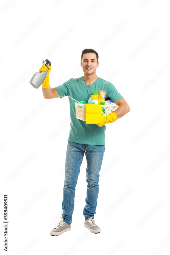 Young man with cleaning supplies on white background