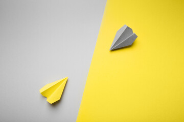 Trend photography on the theme of the new color of the year 2021: Ultimate Gray and Illuminating. yellow and gray planes on the background with copy space