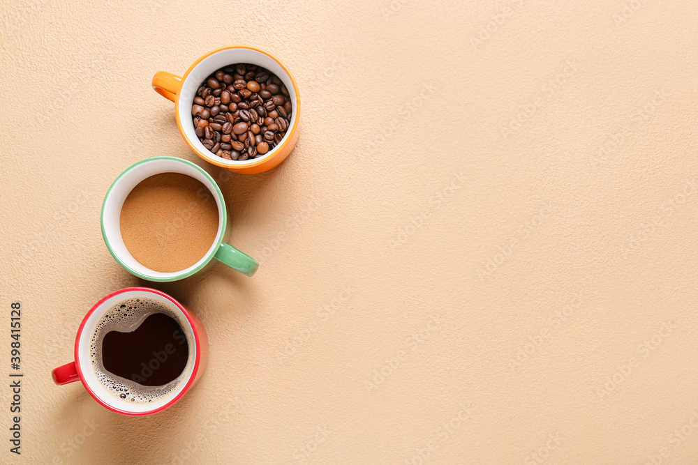 Cups of hot coffee and beans on color background