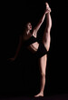 © Pixel-Shot - Beautiful young woman in underwear on dark background