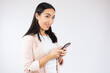 © Danko - Portrait of a happy young business woman using mobile phone isolated over white background