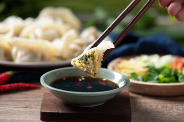 Close up fresh boiled dumplings. Chinese food on rustic old vintage wooden background