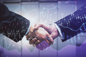 Double exposure of forex graph hologram and handshake of two men. Stock market concept.