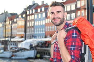 Wall Mural - Young backpacker walking around Denmark