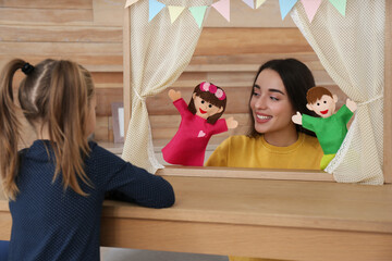 Poster - Mother performing puppet show for her daughter at home