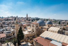 Aerial View Of The Old City With Blue Sky Of Jerusalem. Christian Quarter And Dome Of  The Church Of The Holy Sepulchre. View From The Lutheran Church Of The Redeemer.