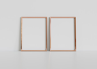 Poster - Two golden frames leaning on white floor in interior mockup. Template of pictures framed on a wall 3D rendering