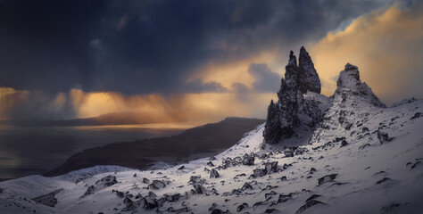 Sticker - ld Man Storr, Isle Skye, Scotland. Winter, very snowy mountain in a very powerful sunrise with some