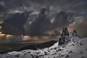 Sticker - ld Man Storr, Isle Skye, Scotland. Winter, very snowy mountain in a very powerful sunrise with some