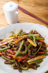 Wall Mural - Chinese-style stir-fry containing green peppers and meat