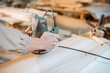 © rh2010 - Worker chamfers wooden bar with a hand machine at the carpentry manufacturing, close-up