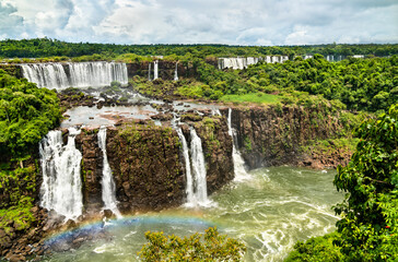 Canvas Print - Rainbow at Iguazu Falls, the largest waterfall in the world. UNESCO world heritage in Brazil and Argentina