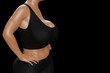 © PixlMakr - Young slim woman with big breasts in black sportswear