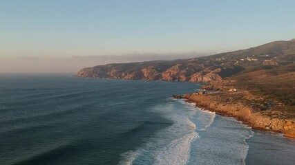 Sticker - Aerial view from a beach at the sunset. Guincho beach in Cascais