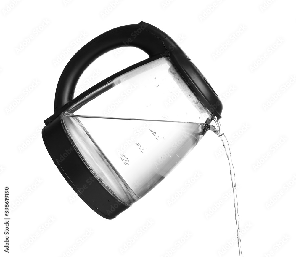 Pouring of boiled water from electric kettle on white background