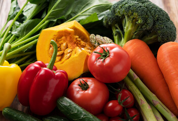 Wall Mural - Many kinds of vegetables placed on a wooden background