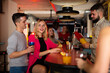 © JackF - Smiling woman and man joying in the night club with drinks in the hand. High quality photo