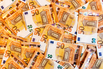 Wall Mural - A close-up shot of a heap of 50 (fifty) euro banknotes: background