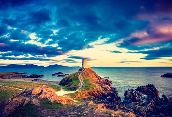 Sticker - Lighthouse on Llanddwyn Island at sunset. North Wales