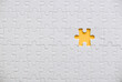 Top view of an empty space of white jigsaw puzzle on a yellow background.