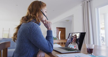 Poster - Caucasian woman on laptop video chat wearing phone headset at home