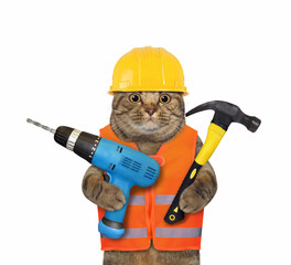 A cat worker in a yellow construction is holding a blue hand electric drill and a hammer. White background. Isolated.