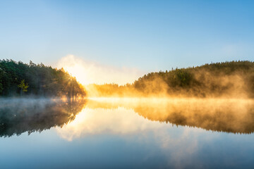 Canvas Print - Sunrsise at the lake with morning fog