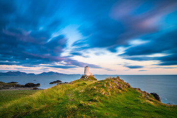 Canvas Print - Lighthouse on Llanddwyn Island viewed at sunset. North Wales. UK