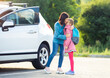 © Ievgen Skrypko - Primary school girl saying goodbye to mother on car parking