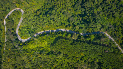 Wall Mural - aerial view mountain paths rural road between the city