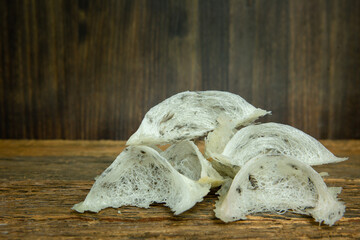 Many swallow's nest on the wood floor close up