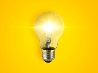 concept creativity with bulbs that shine glitter on yellow background