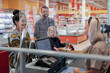 © Johnér - Family at till in supermarket