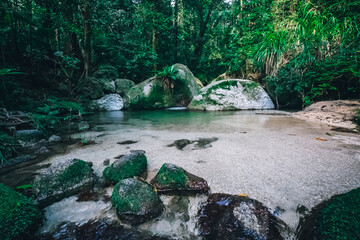 Wall Mural - a river with rocks and trees