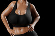 © PixlMakr - Young slim woman with big breasts in black sportswear