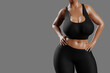 © PixlMakr - Young slim woman with big breasts in black sportswear