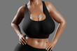 © PixlMakr - Young slim woman with big breasts in black sportswear