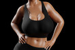 © PixlMakr - Young slim woman with big breasts in black sportswear