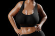 © PixlMakr - Young slim woman with big breasts in black sportswear