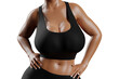 © PixlMakr - Young slim woman with big breasts in black sportswear