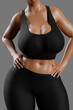 © PixlMakr - Young slim woman with big breasts in black sportswear