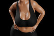 © PixlMakr - Young slim woman with big breasts in black sportswear