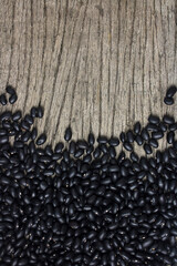 Wall Mural - Black beans set up on the rustic wooden background