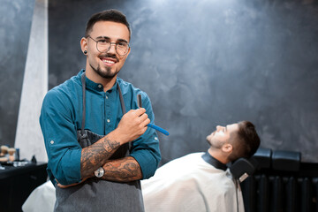 Wall Mural - Professional hairdresser and his client in barbershop