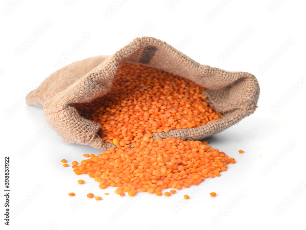 Sack with red lentils on white background