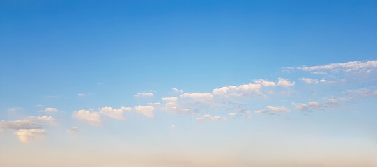 Canvas Print - Clear blue sky with clouds above horizon