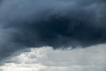 Canvas Print - Light sky with impending ominous black cloud